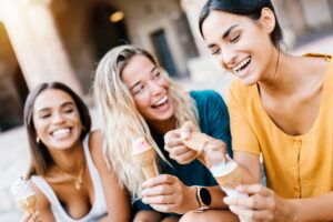 Happy multiethnic women laughing together outdoors