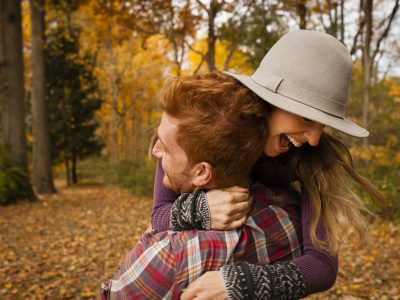 Young couple hugging in autumn forest